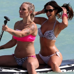 Claudia Romani paddleboarding with Friend