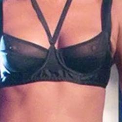Jennifer Aniston in a see-through bra on set