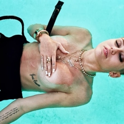 Miley Cyrus covered topless in Rolling Stone Mag
