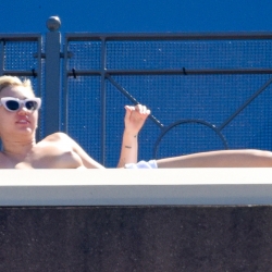 Miley Cyrus Sunbathes Topless