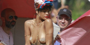 Rihanna covered topless for Vogue Brazil