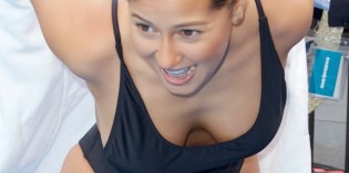 Adrienne Bailon wears a swimsuit in NYC